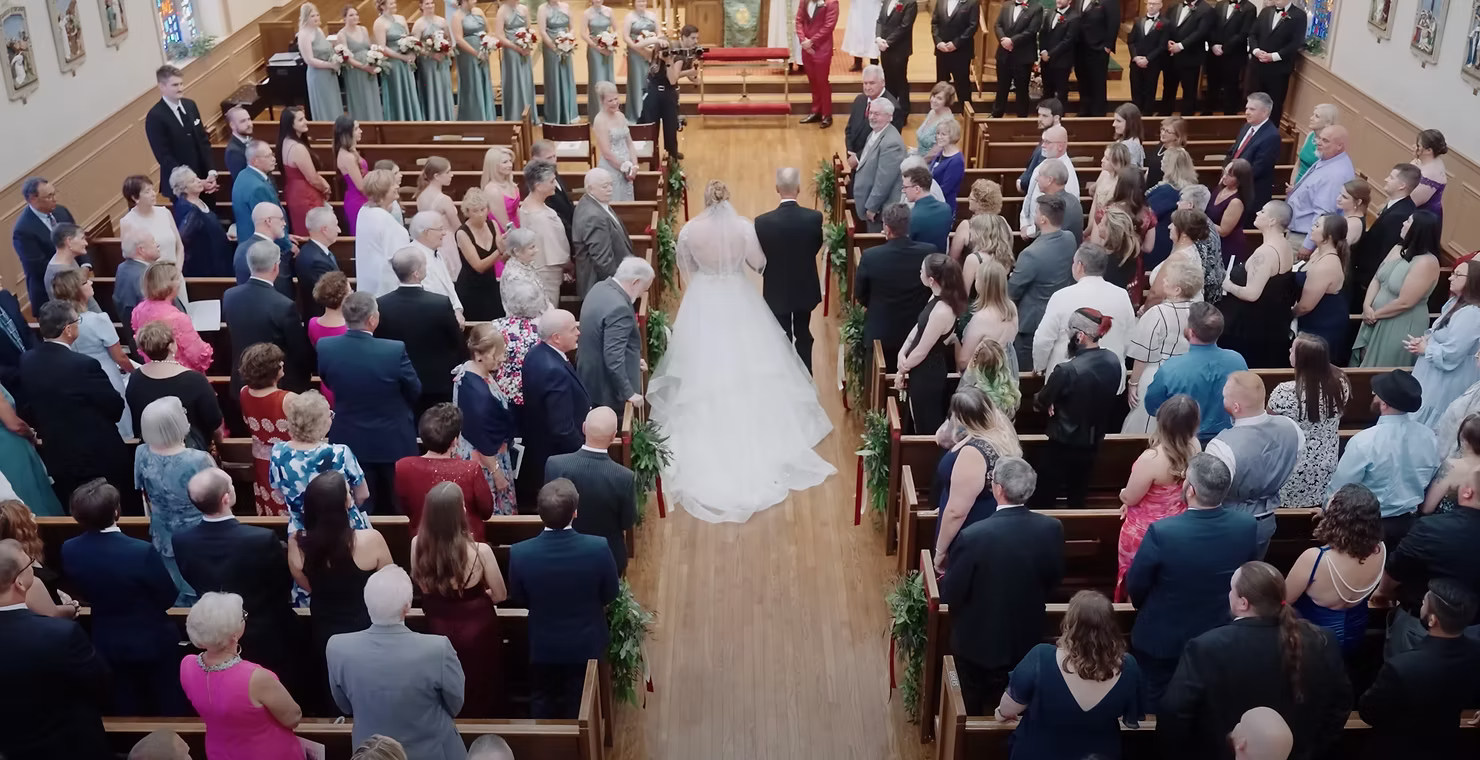 Formal church wedding ceremony with guests in pews